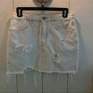 Distressed white jean mini skirt
